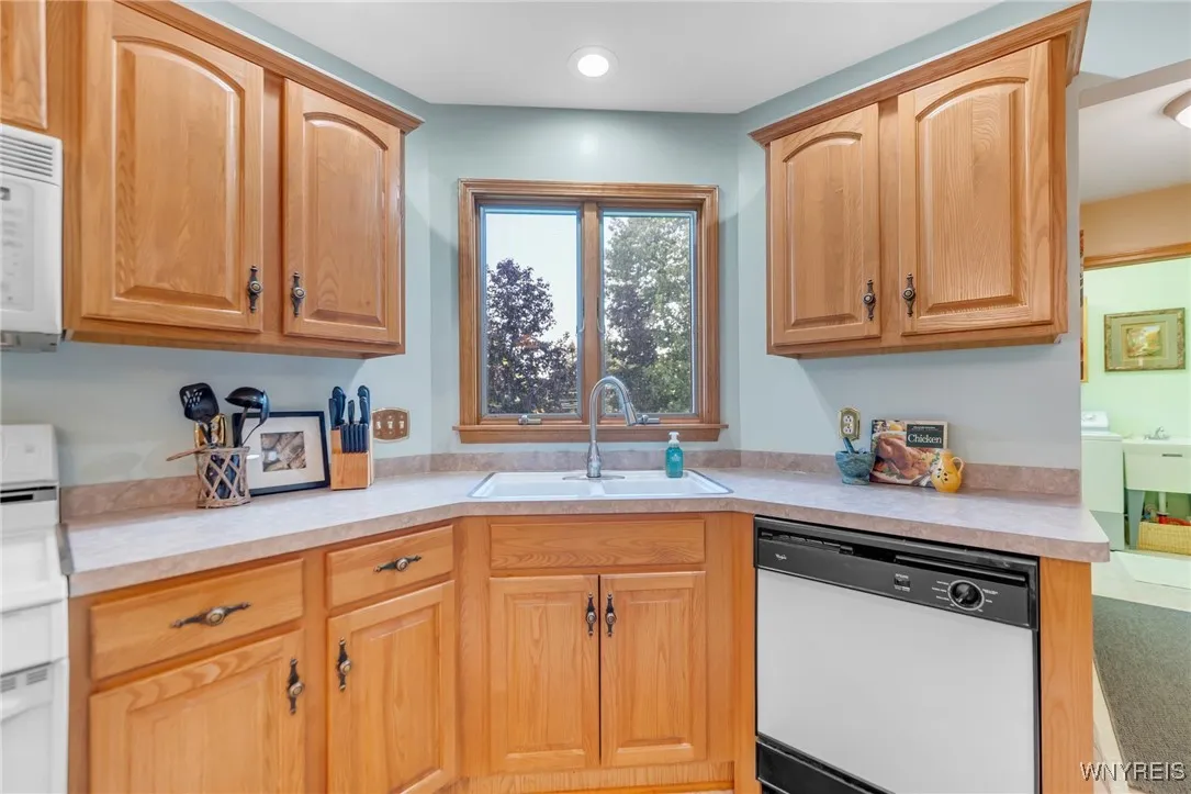 Double sink with delightful view of the backyard.