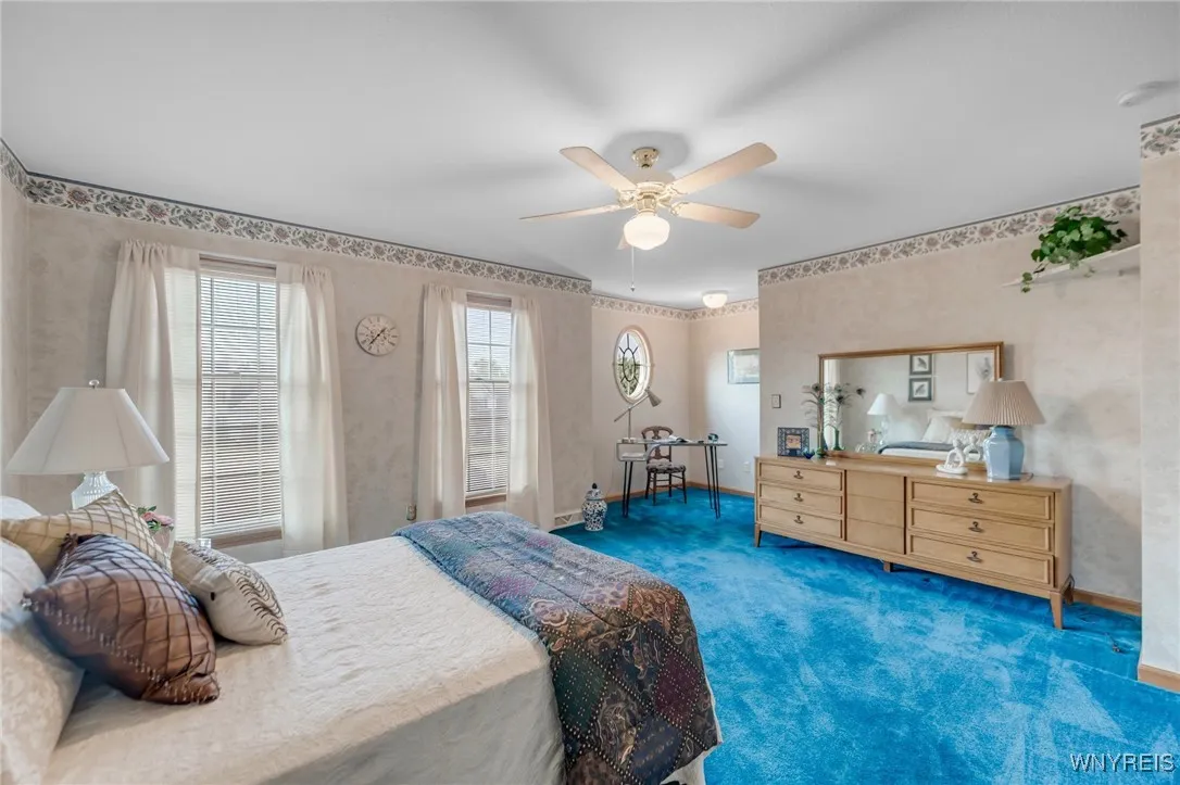 Huge second bedroom holds plenty of furniture.  Ceiling fan here too!