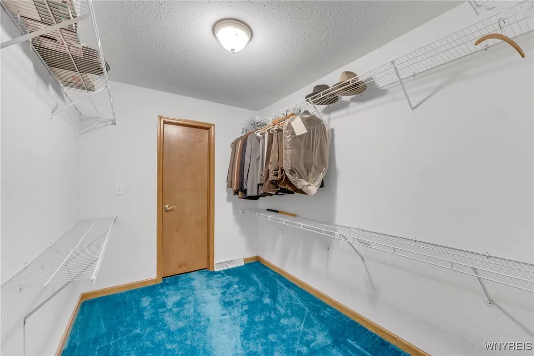 Second Bedroom walk in closet.  The door leads to walk in attic that easily could be finished off into an additional room.