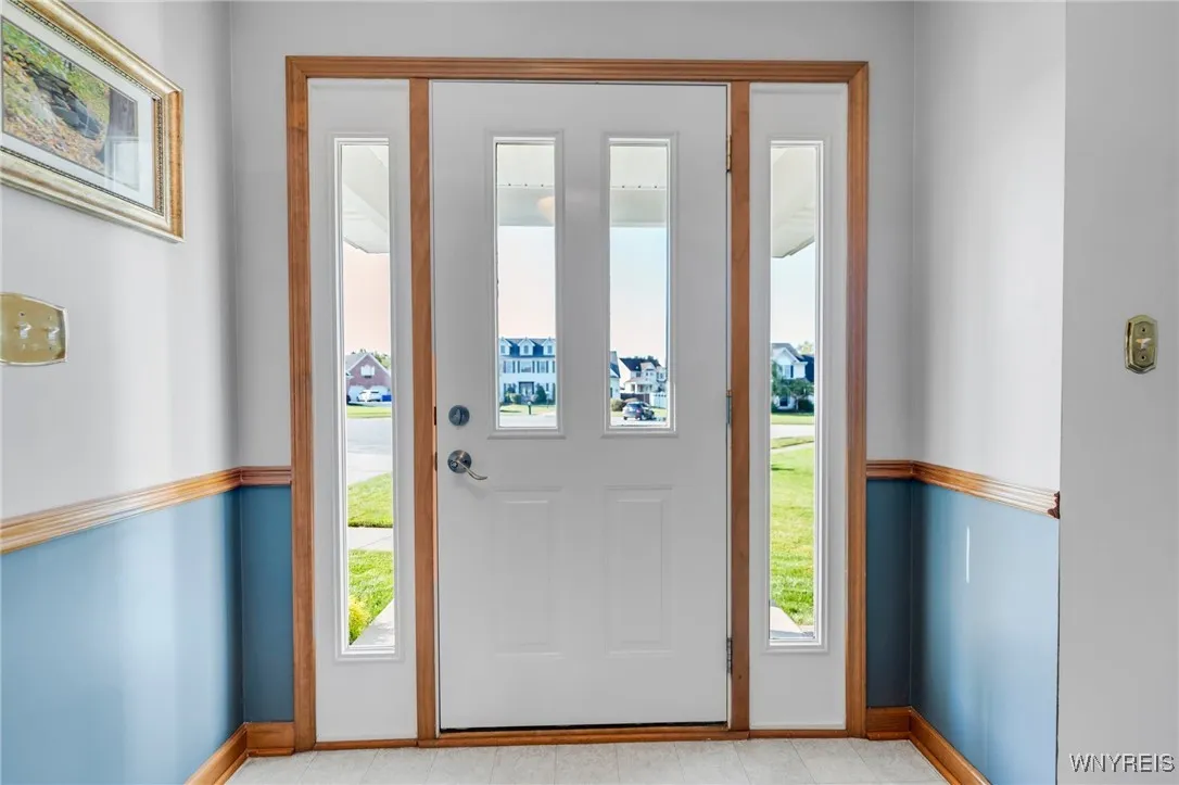Front door with side lights make for such a bright and sunny Foyer.