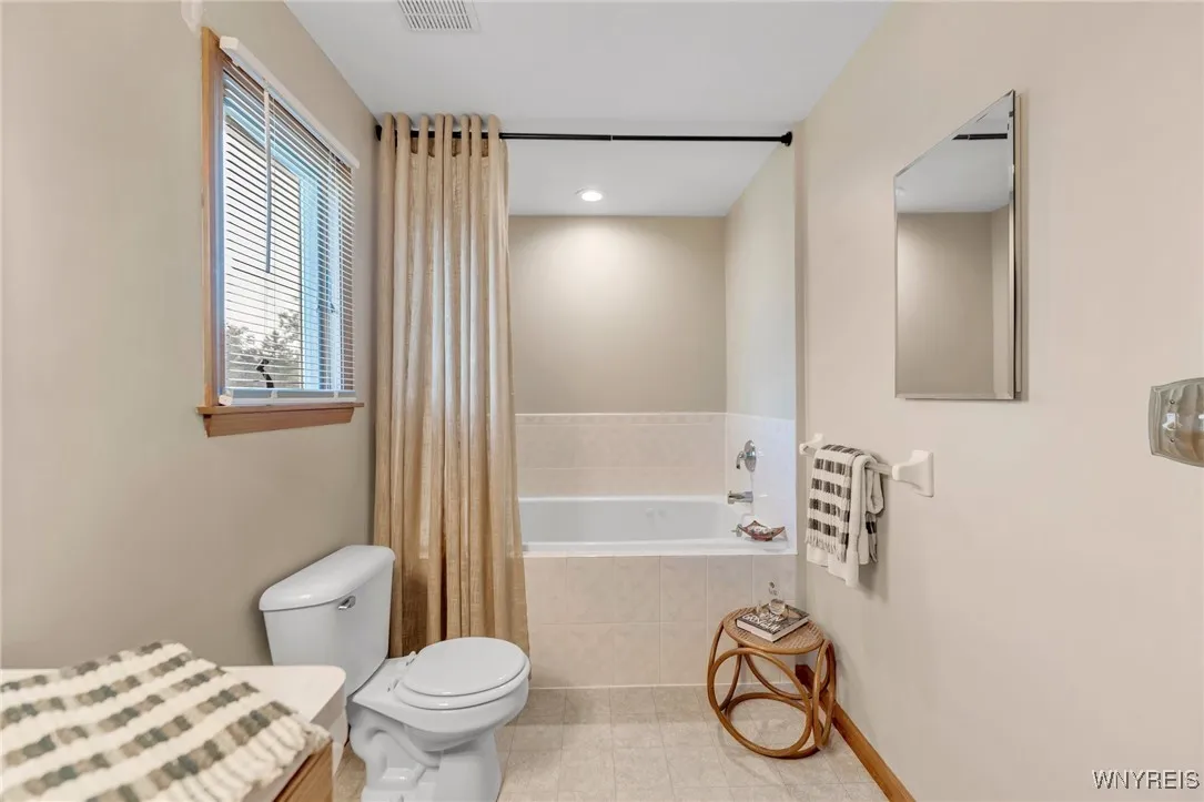 Primary ensuite bath with whirlpool tub.