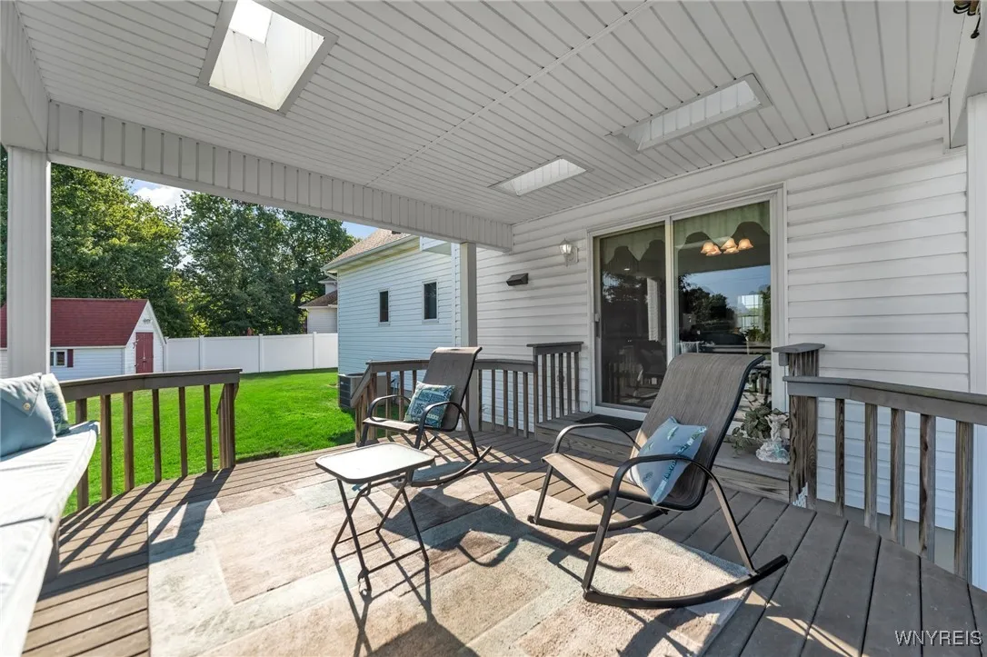 Awesome maintenance free deck off kitchen with roof and skylights.