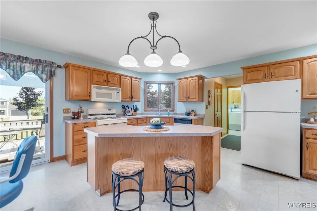 Cozy up at the island for additional seating options... a perfect Breakfast Bar!