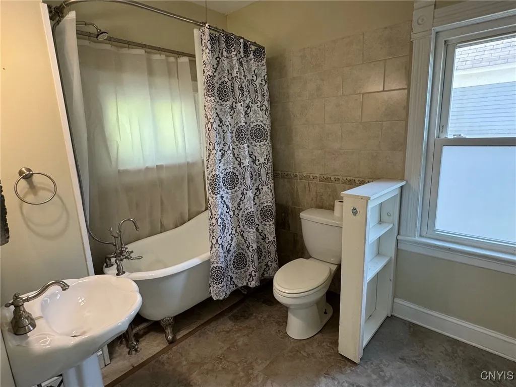 Upstairs - Full bath w/ ceramic tub surround & floor