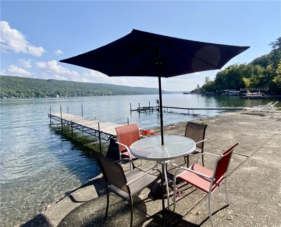 50' LEVEL LAKE FRONT - EXPANSIVE PATIO BREAKWALL & DOCK!