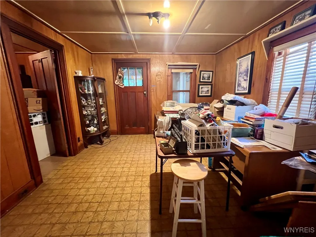 Living room towards enclosed front porch.