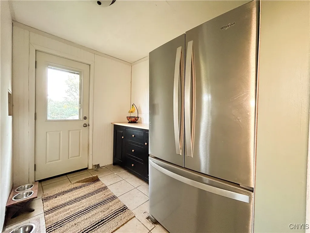Pantry  with exit to the fenced in yard