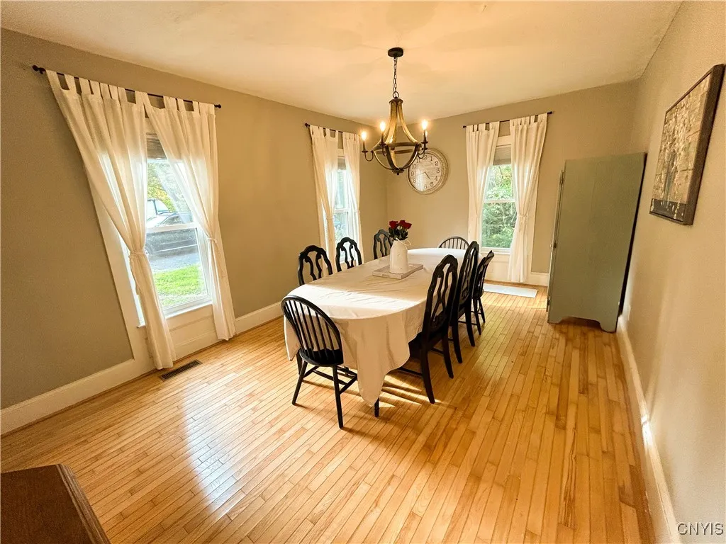 Formal Dining Room with Wood Flooring.