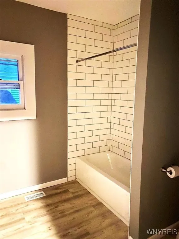 Modern tile work in all bathrooms.
