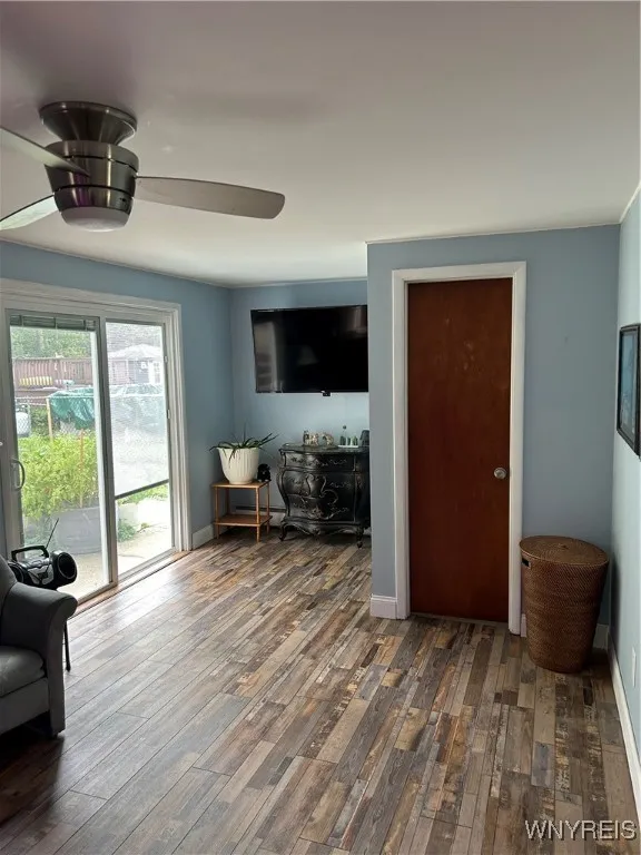 Family room with sliding door out to patio and raised garden beds