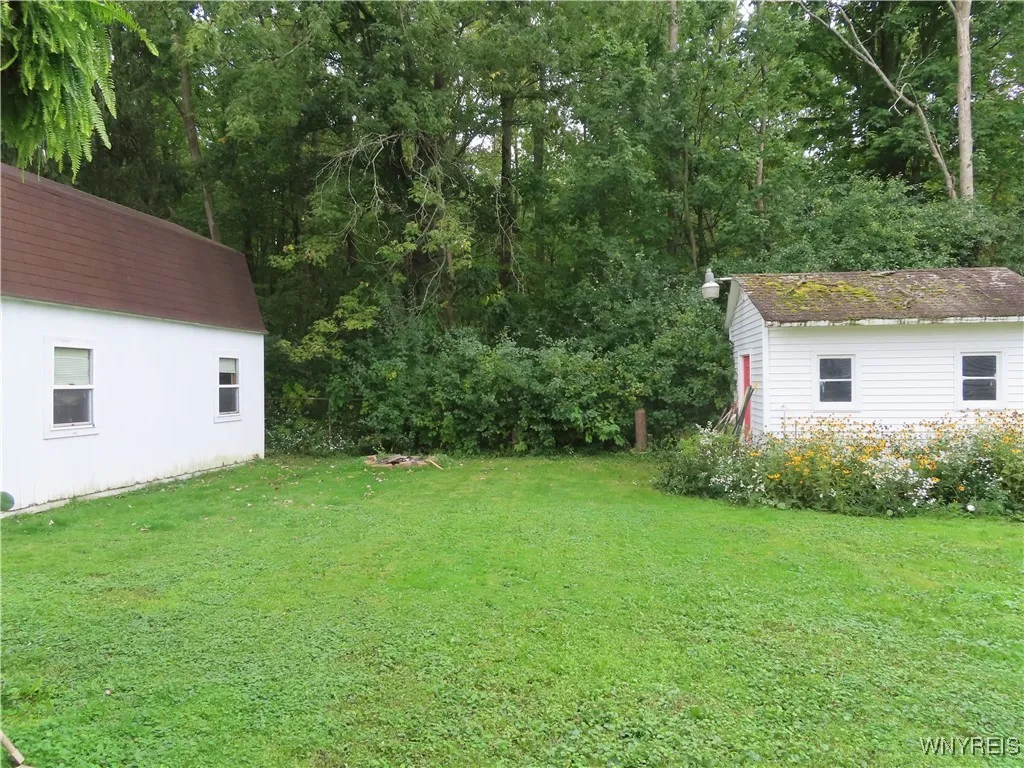 back of yard with shed and workshop