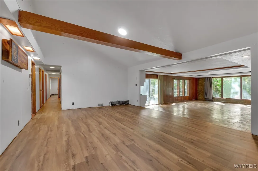 The hallway leads to the bedrooms a full bath and at the end is the owners suite or in-law set up.