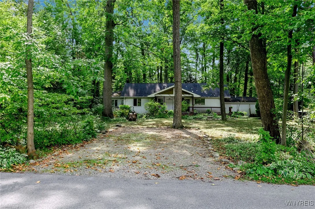 Elmhurst Drive driveway and there is another driveway located on Woodland Drive