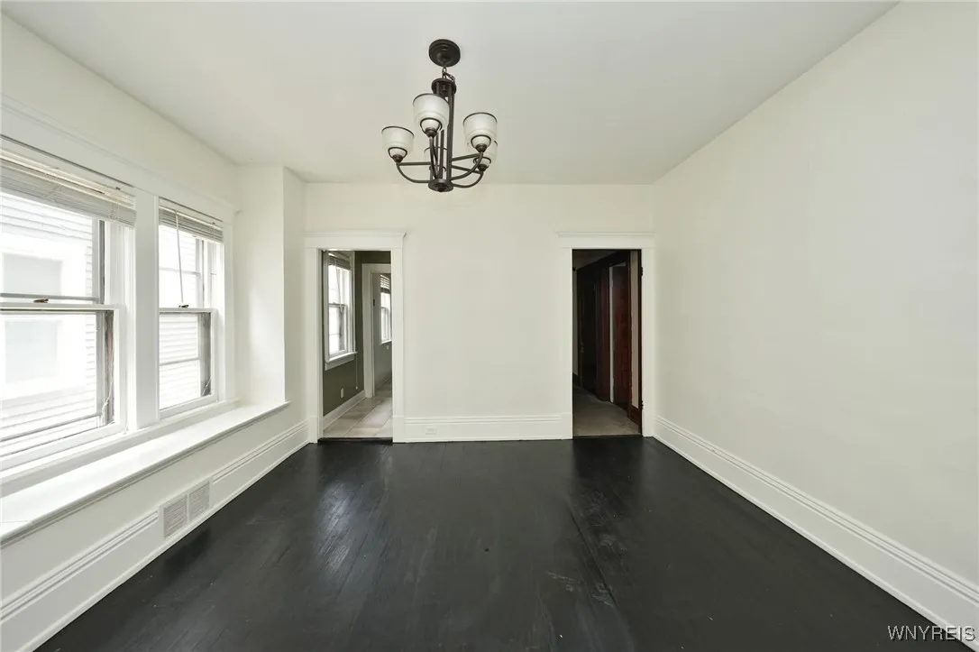 Dining area, leads to kitchen or hallway