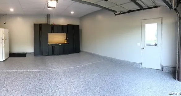 Spacious 2 car garage with epoxy floor