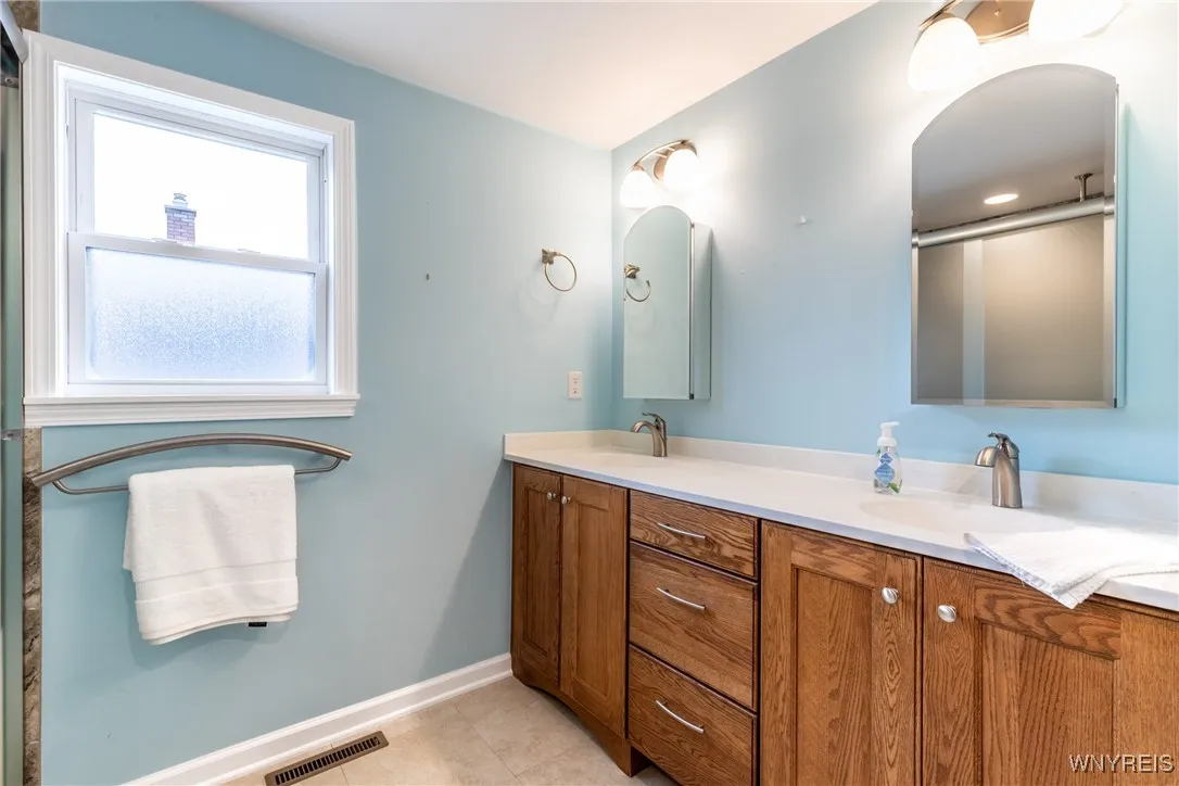 Extra large 1st floor bath with two sinks and med cabinets! Also individual switches for lights above medicine cabinets.