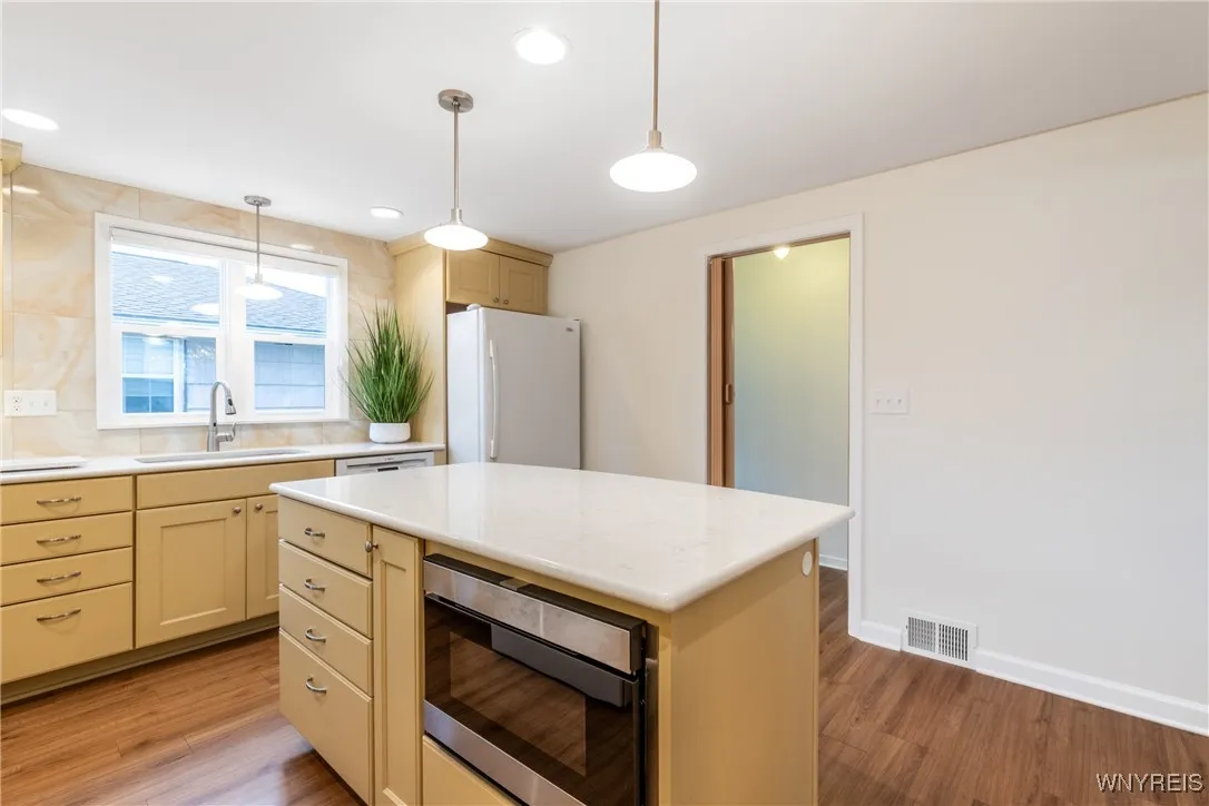 Half bath is behind blank wall to the right.