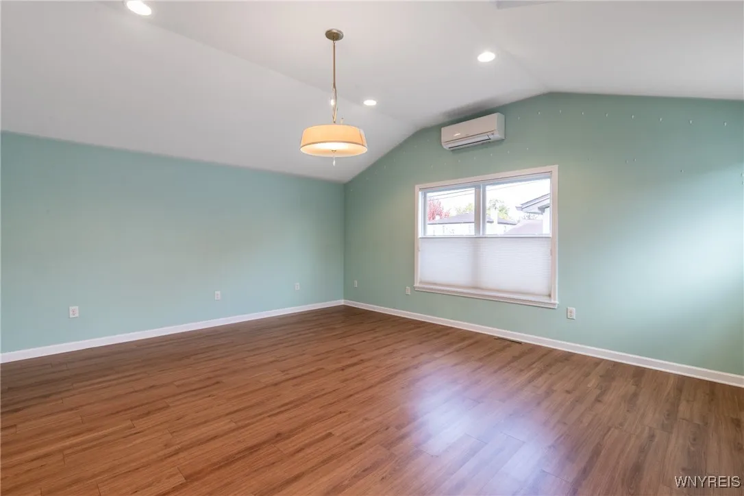Tall ceilings in this addition! Custom blinds too! There is additional  and a heating and cooling for this area!