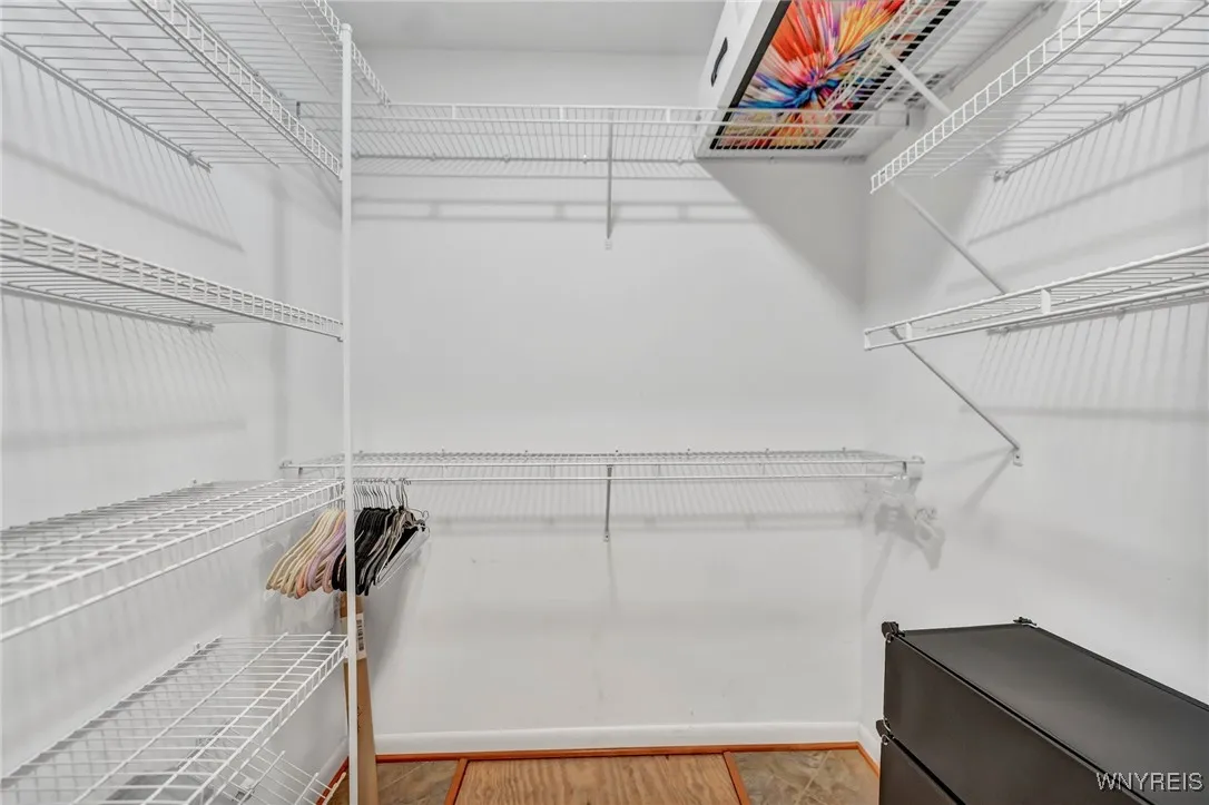 One of 2 walk-in closets in primary bath.