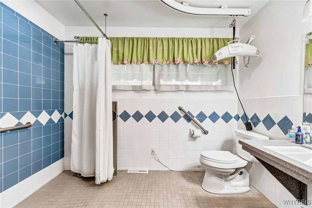 Accessible bathroom attached to 4th bedroom.