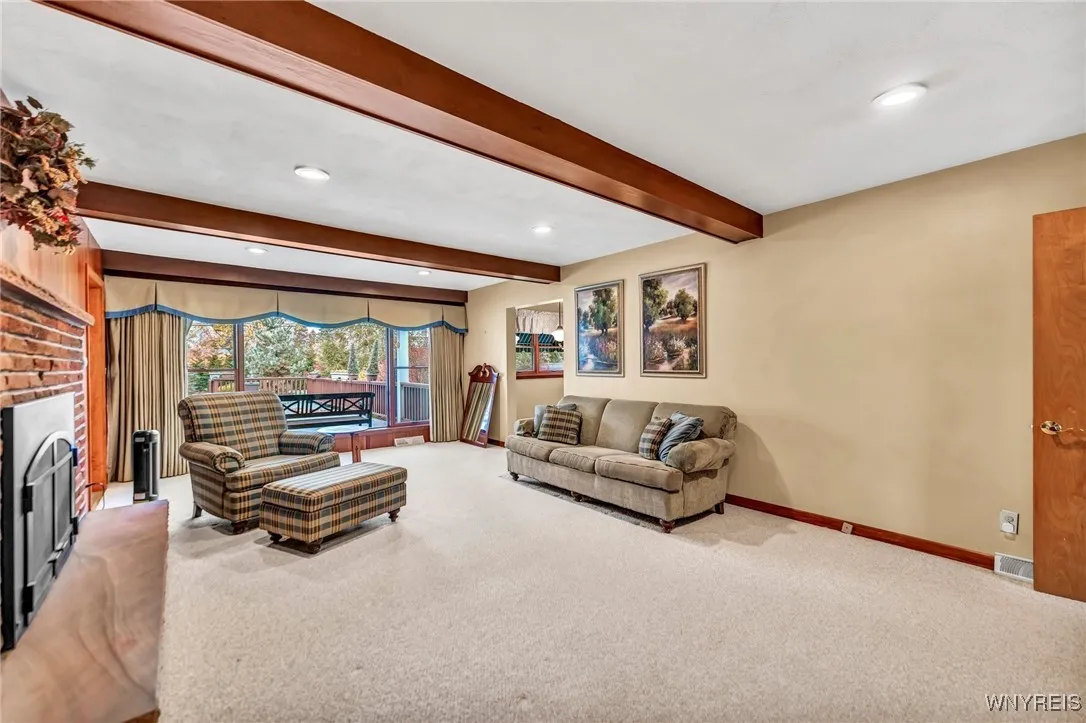 Family room looks out to patio and .5 acre yard.