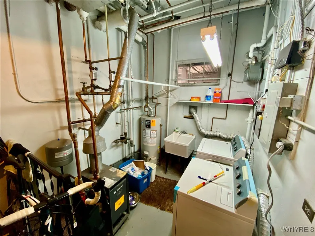 Lower level laundry and mechanics room also has storage.