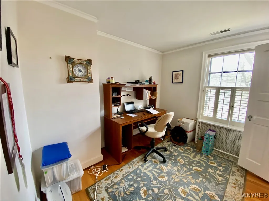 Bedroom has a Jack & Jill bathroom, hardwood floors and plantation shutters.