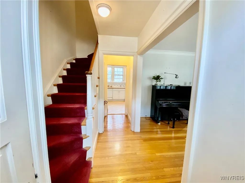 Entry hall on main level with staircase to bedroom level.