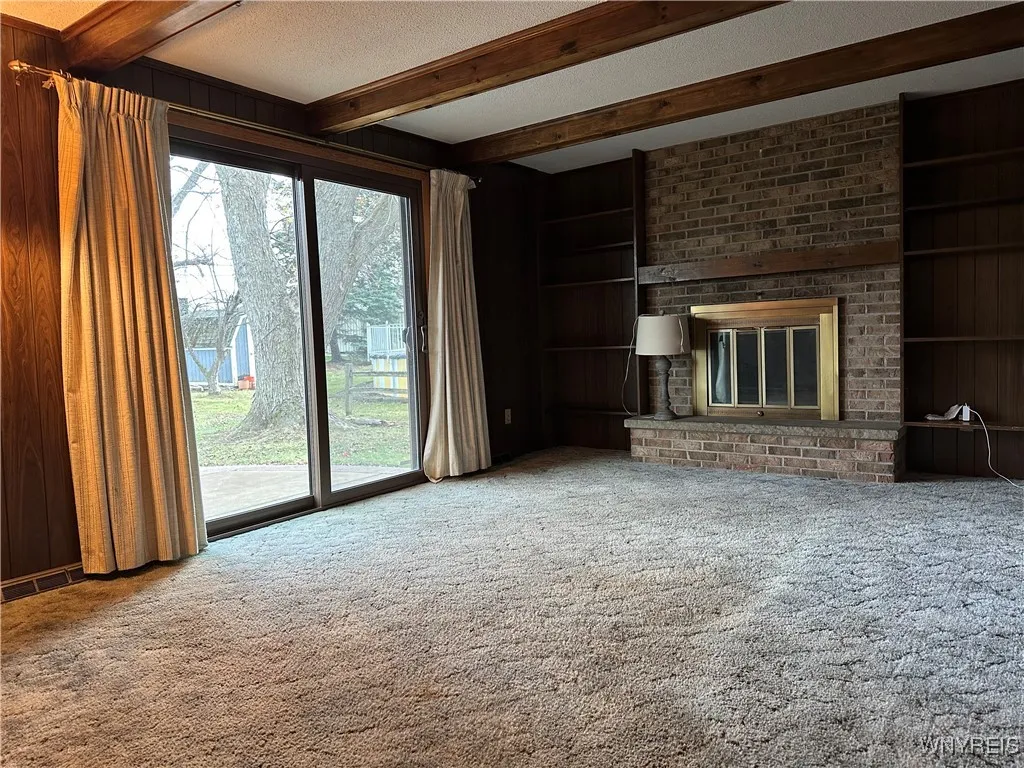 Family Room with wood burning fireplace and sliding door to rear patio!