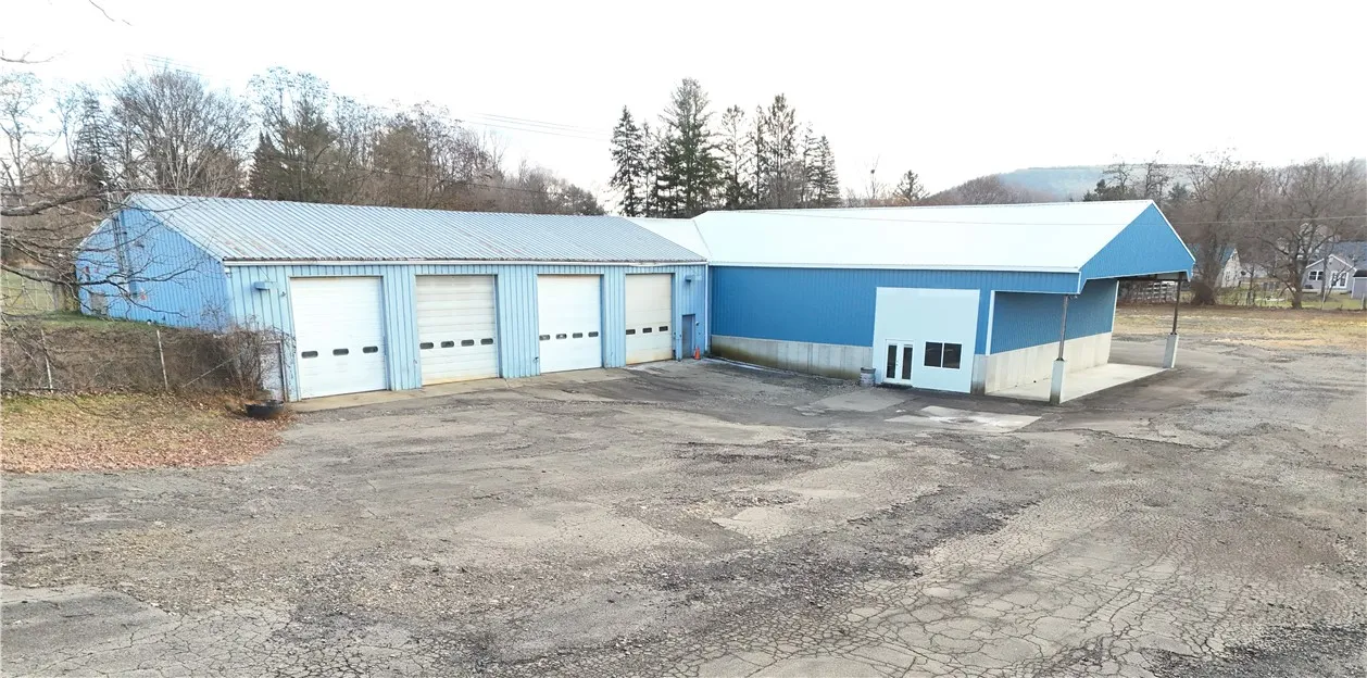 Vehicle storage/workshop w overhead doors. Brew House patio