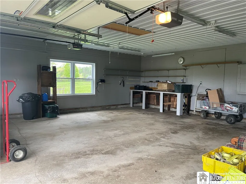 28x28 double car attached garage with pull-down steps to floored attic