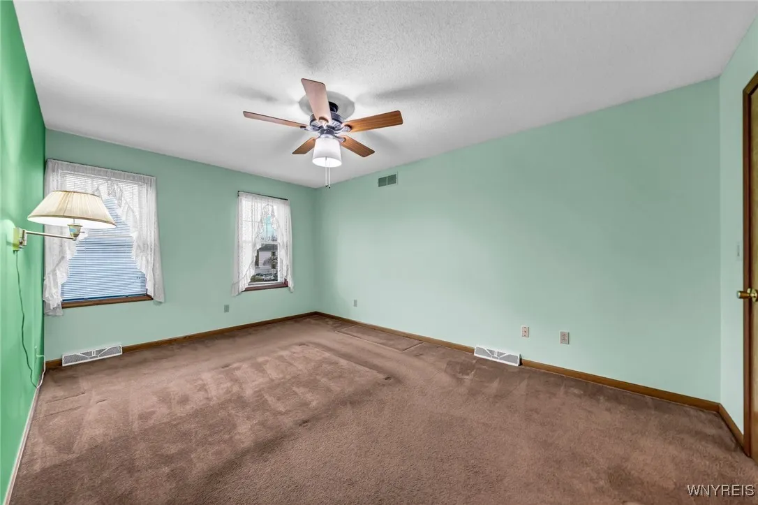 Another view of primary bedroom.