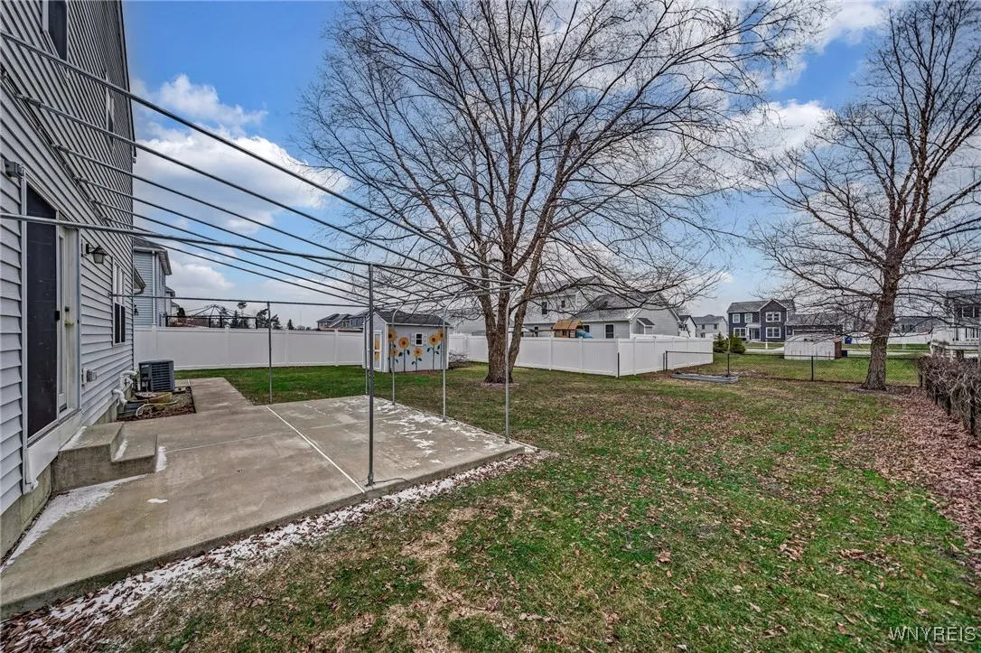 Wonderful patio with sidewalk that connects to backdoor of garage.