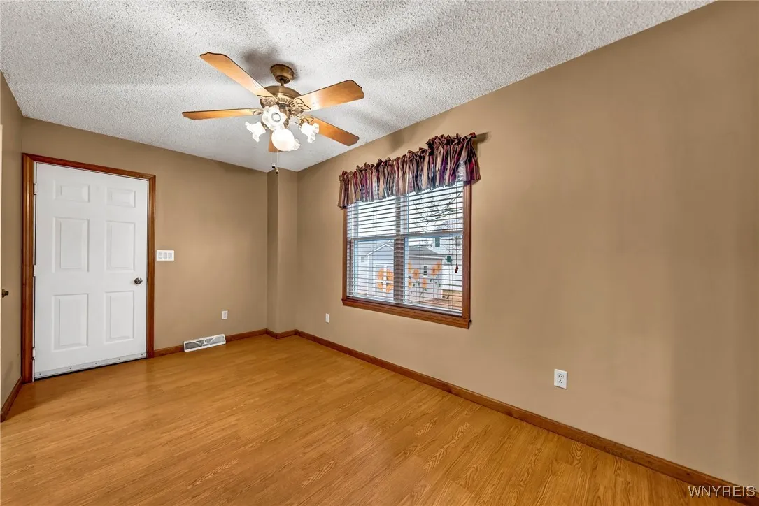 Another view of dining room. Door leads to attached garage. Enjoy your morning coffee while looking out to your fully-fenced yard.