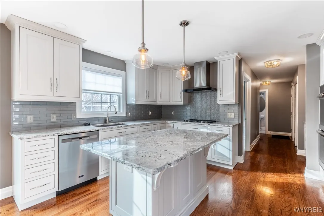 Beautiful white Omega custom cabinets covered with Quartz counter tops.