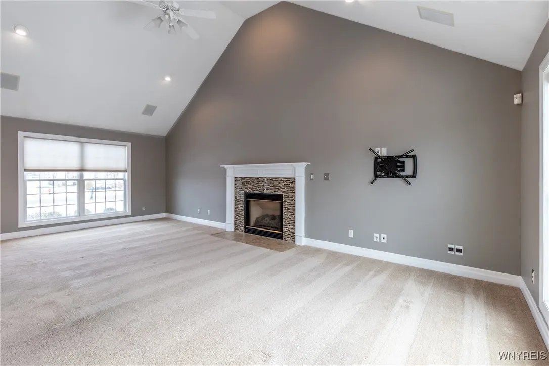 Large gas fireplace accents the great room.