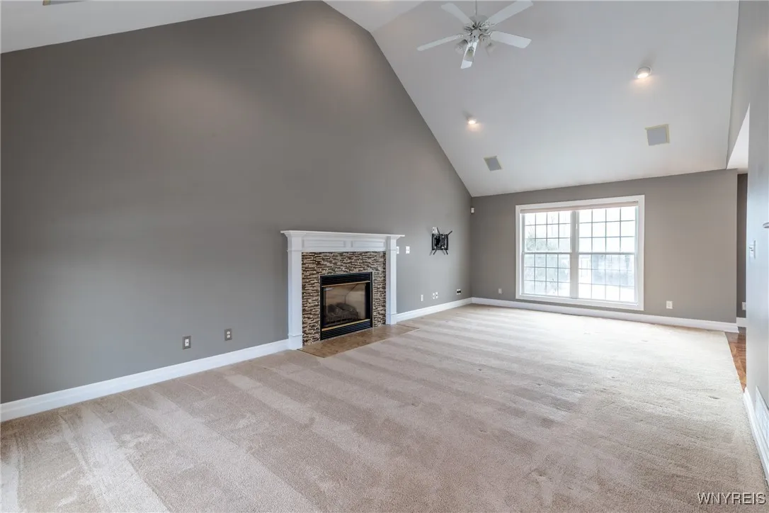 Vaulted ceiling highlight the great room.