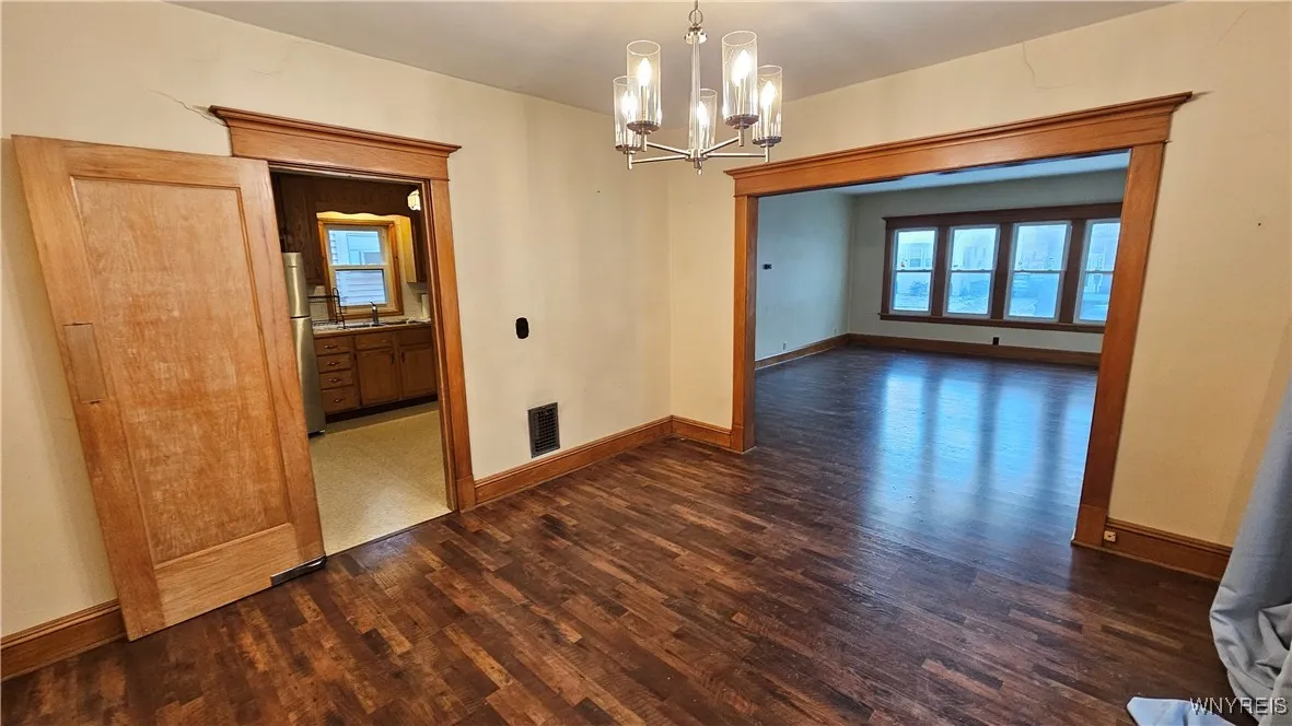 Dining room looking to kitchen and living room