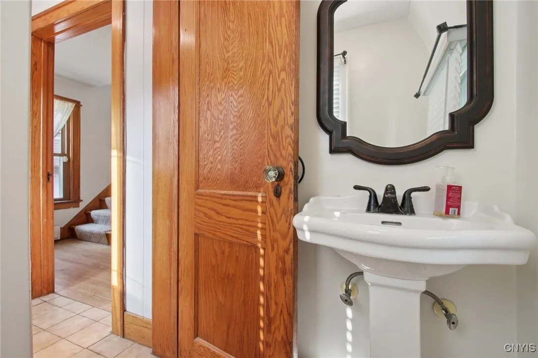 Half bath off of the foyer.