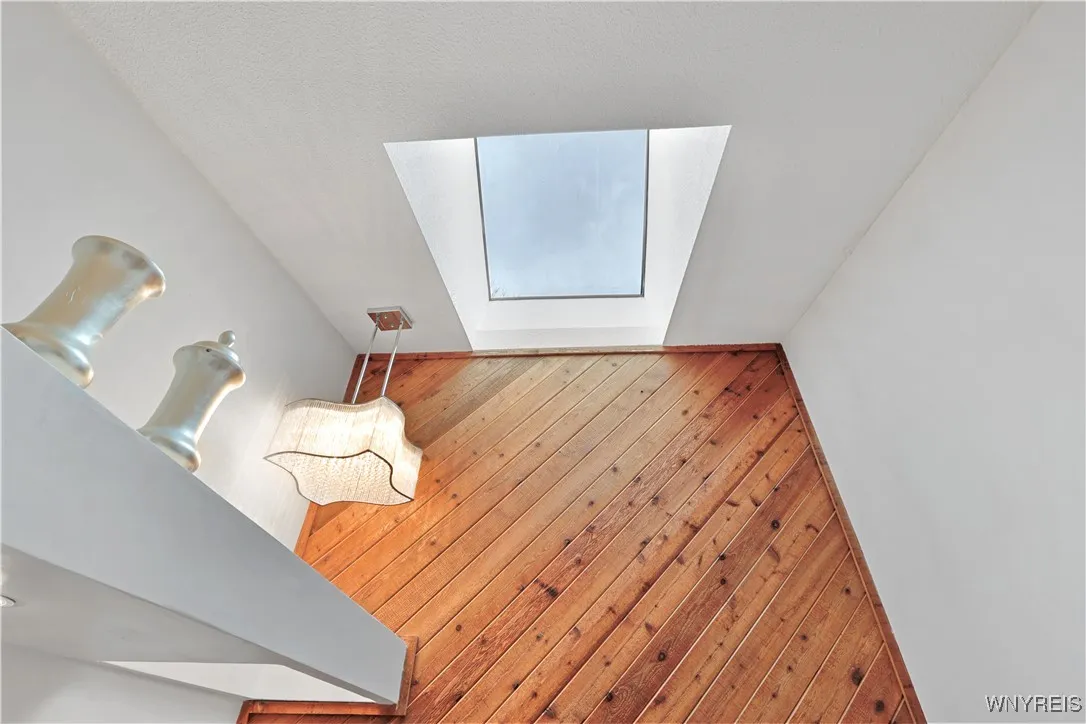Owners suite bathroom w/skylight and chandelier
