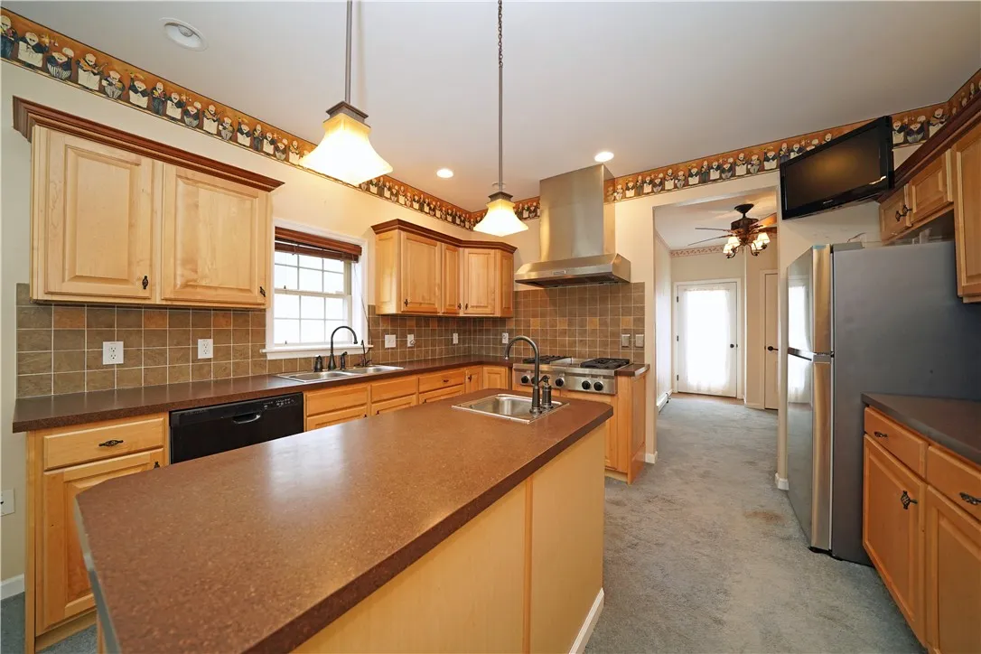 Kitchen showing side door to North side of deck