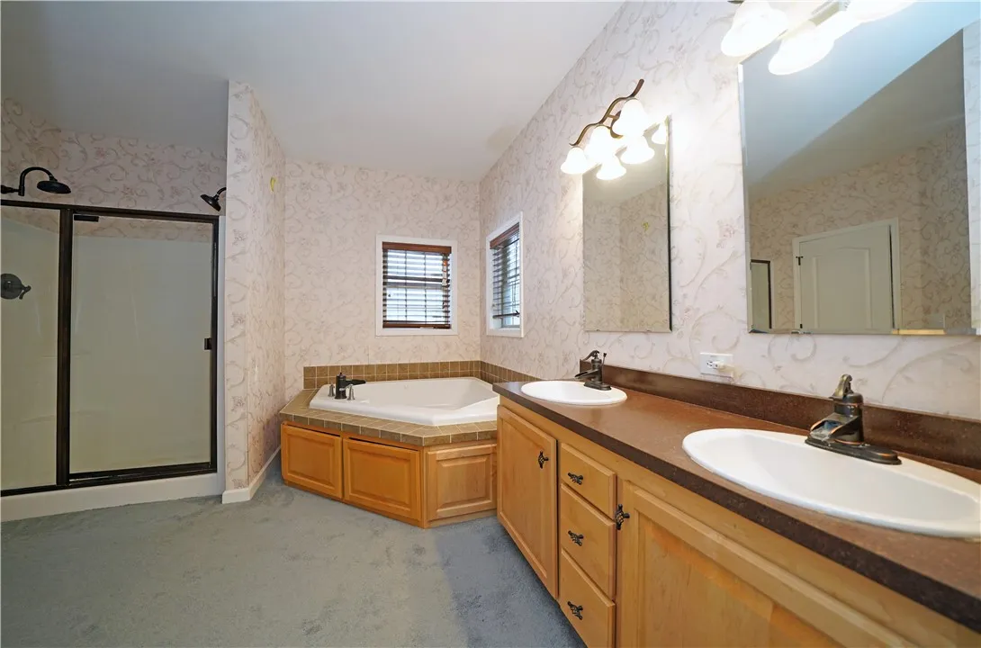 Primary bedroom garden tub, double sinks and shower