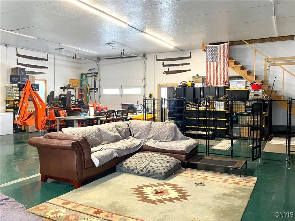 Expansive, insulated, heated garage with 2nd floor