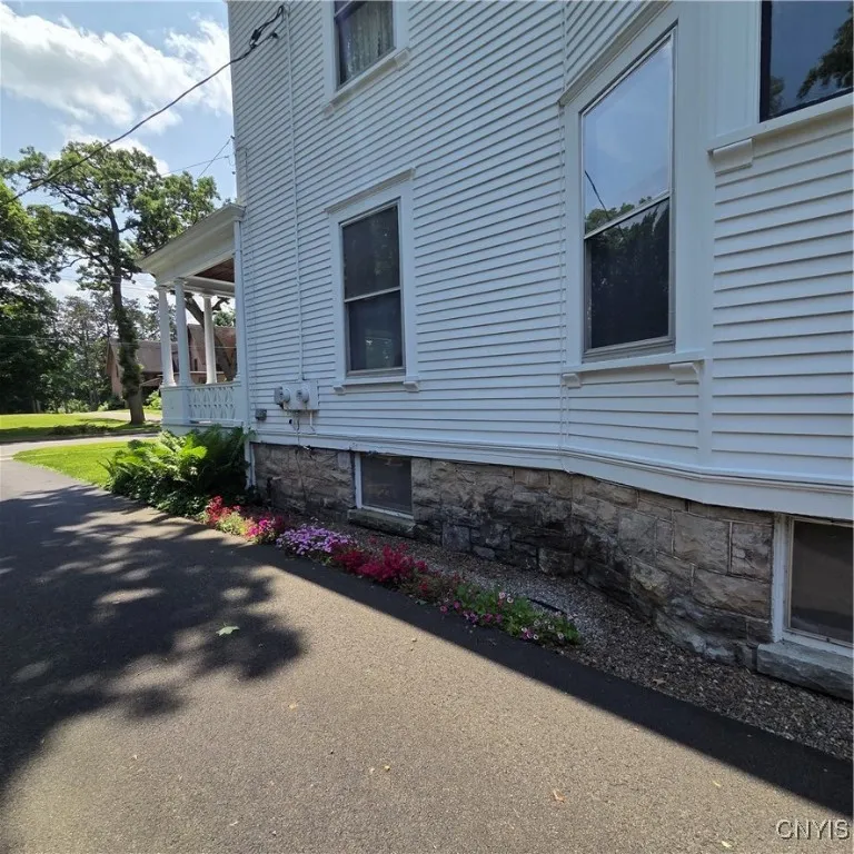 Side view of blacktopped driveway