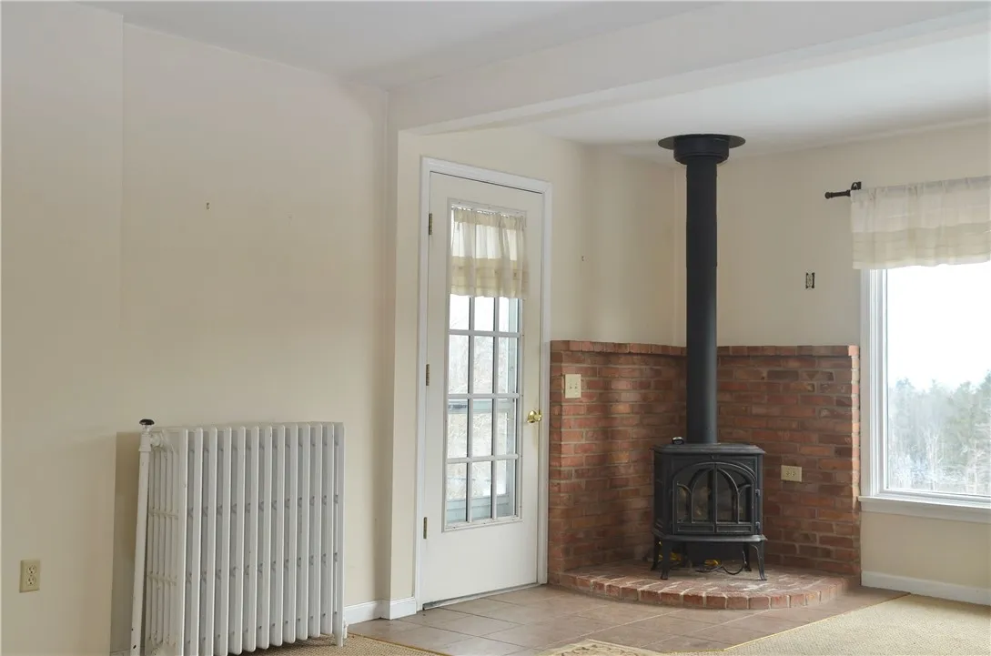 Natural gas fired Franklin Stove & side door exit.