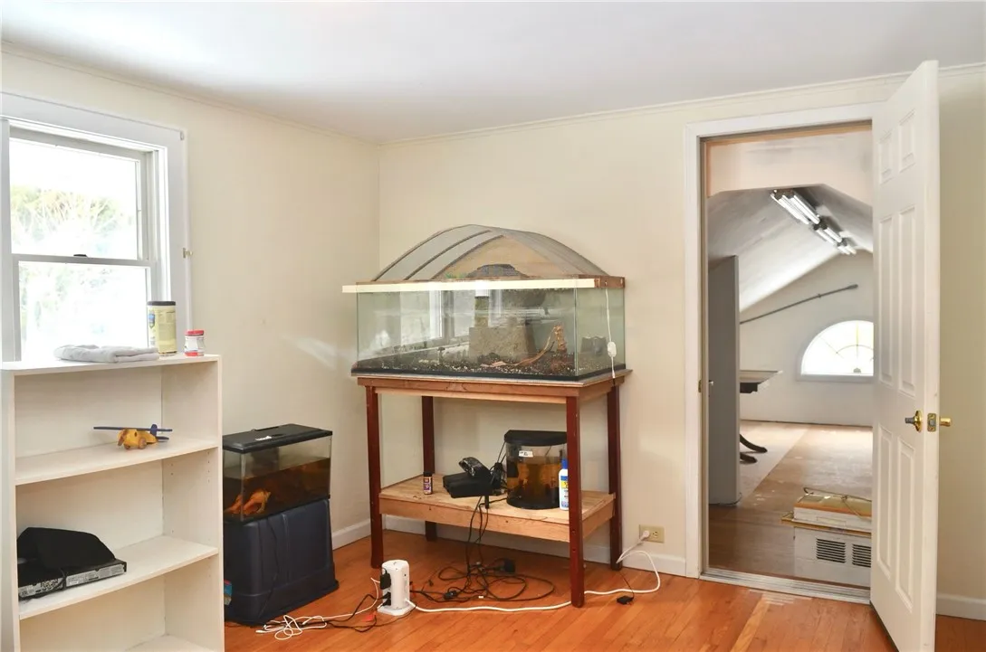 Bedroom with closet/attic  entry.  Room is ~10 x ~12 (Measurements are approximate.).