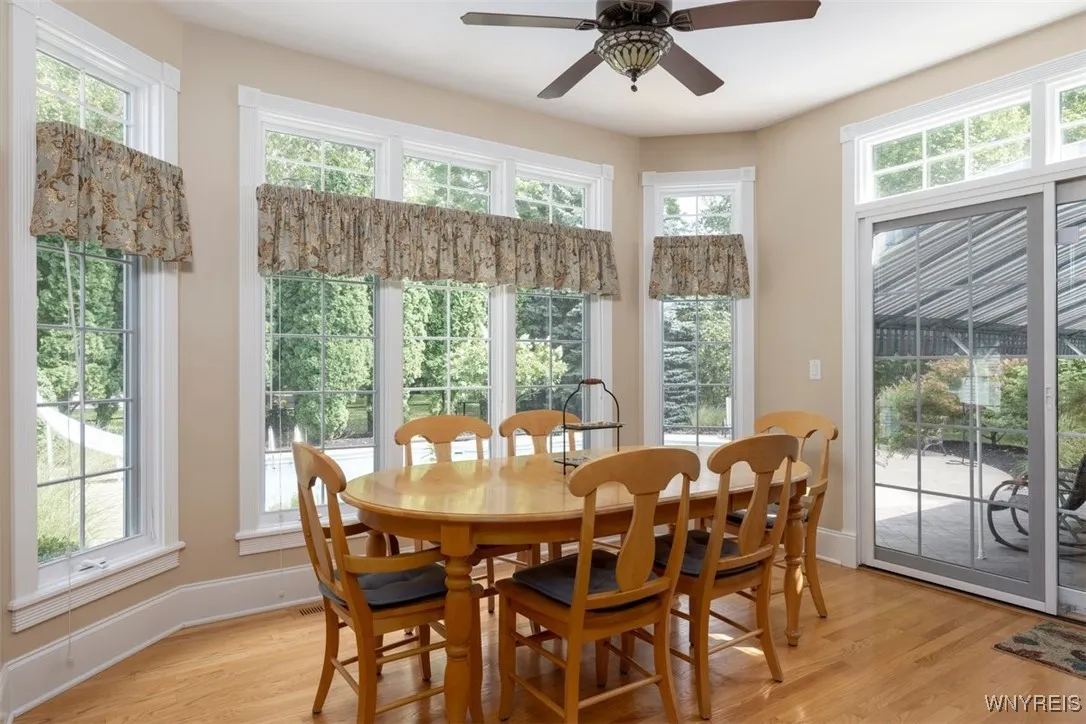 Kitchen eat-in area opens to patio with covered awning, and view of pool.  Very private rear yard.