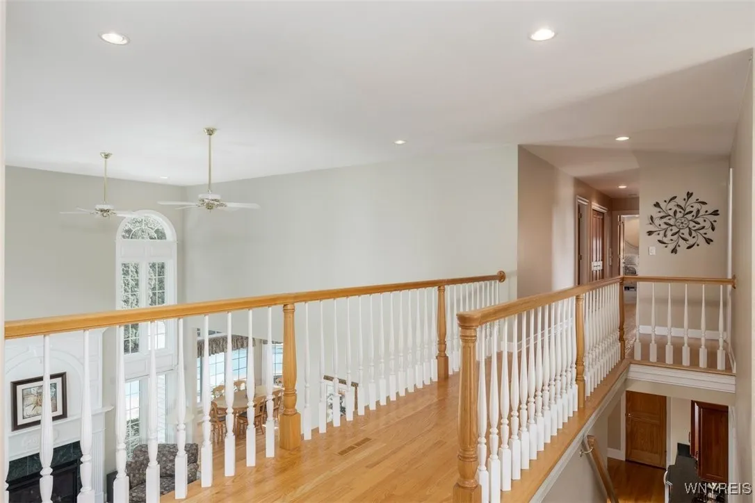 Upstairs hallway and landing are hardwood, opens to front and rear of the house.
