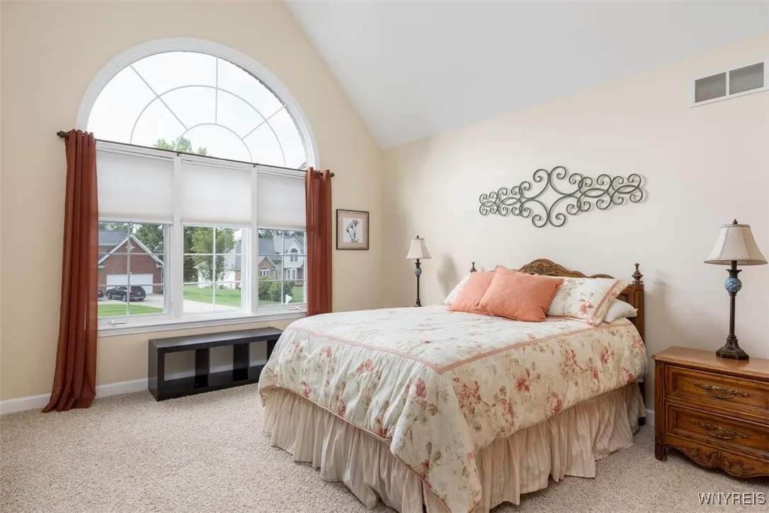 Bedroom 5 with roundtop window and double closet.