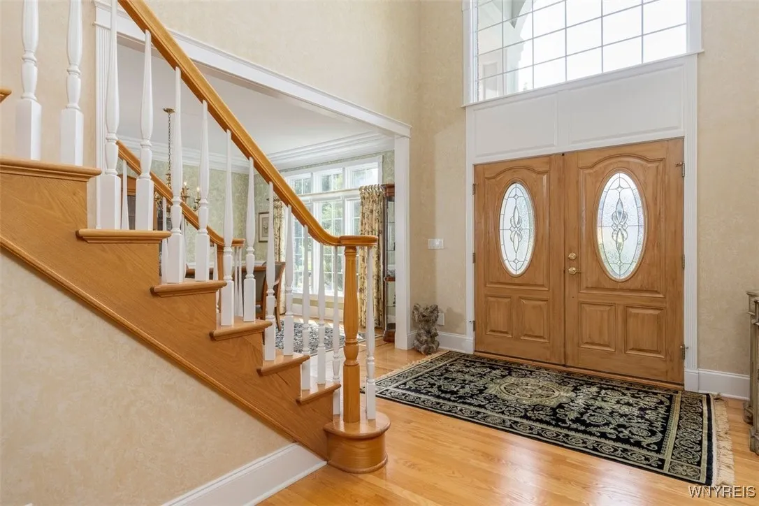 Transom over front door lets in loads of natural light.